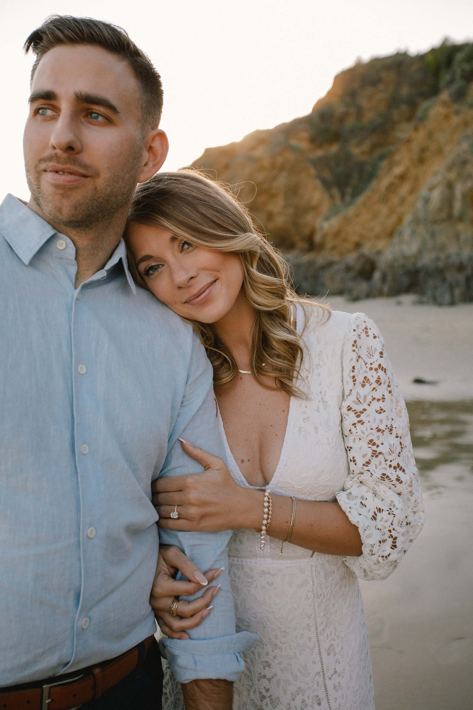 Kait resting her head on JJ's shoulder.