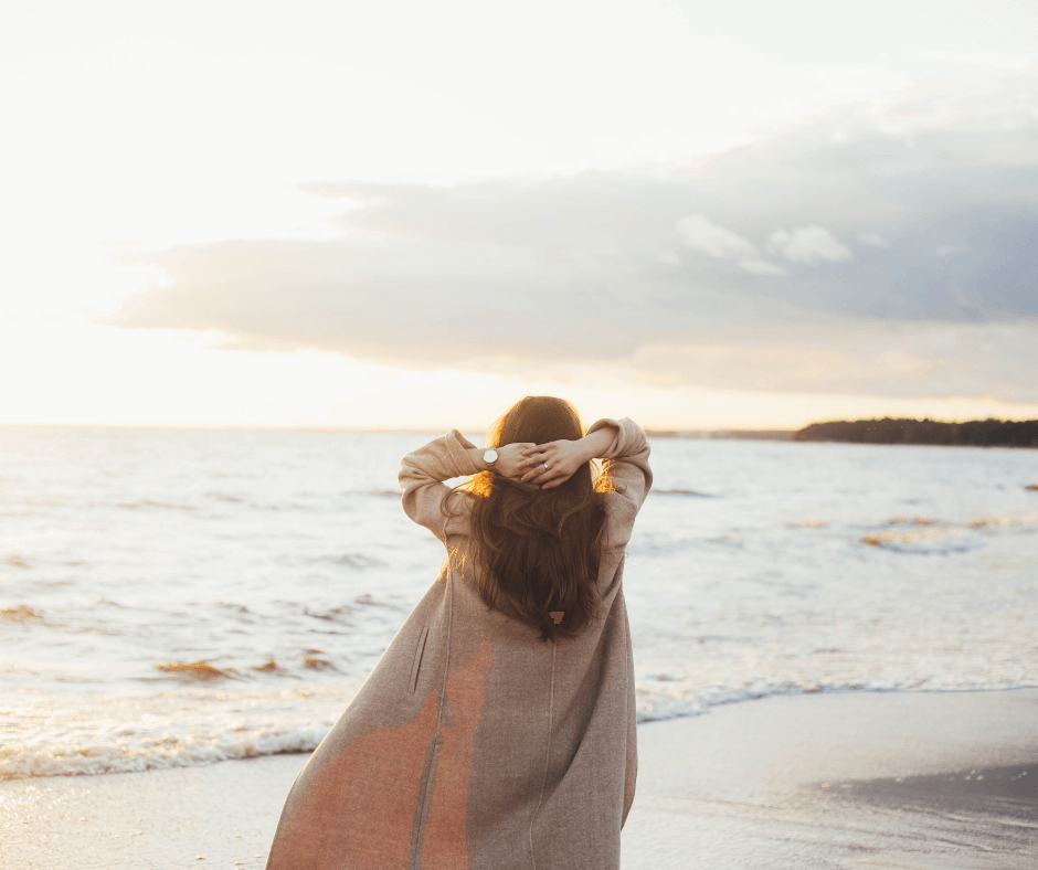 Woman looking out over a lake